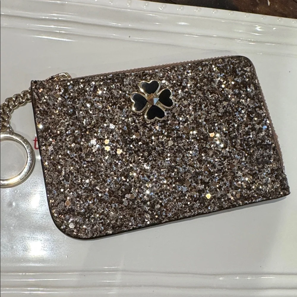 Kate Spade glitter clutch wristlet in gold and black